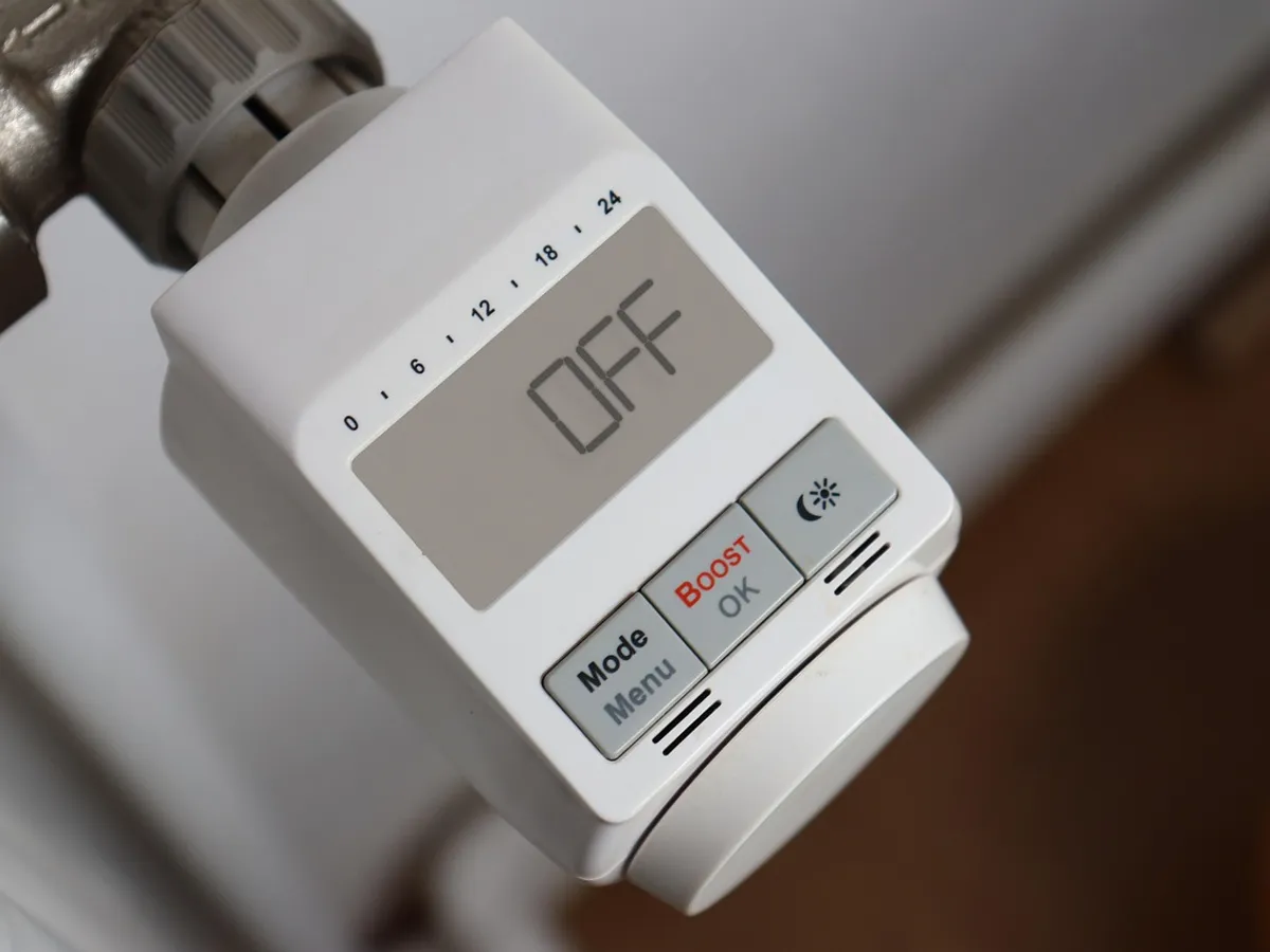 Home thermostat for heating and cooling